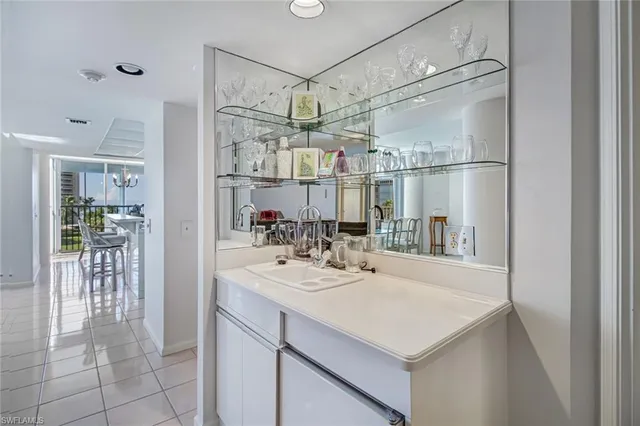 a kitchen with a sink and refrigerator