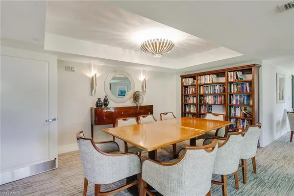 a view of a dining room with furniture and a wooden floor