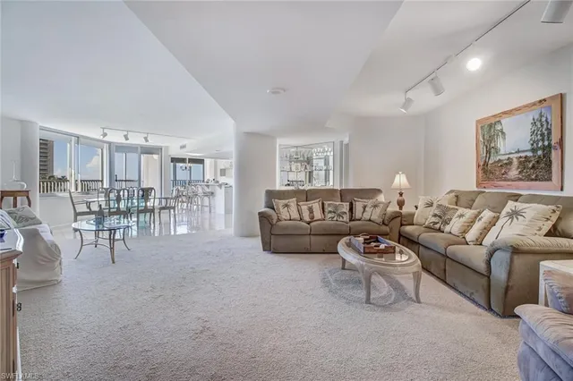 a living room with furniture and a table