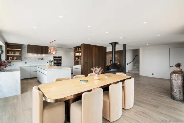 a dinning table and chairs in a kitchen
