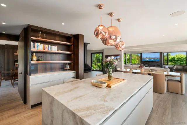a living room with furniture and a lamp