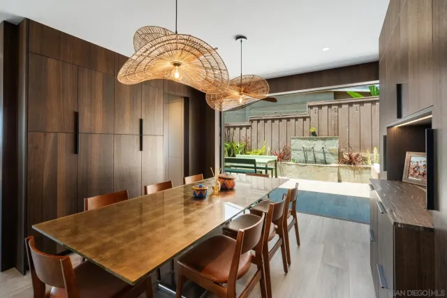 a view of a house with a big yard and sitting area