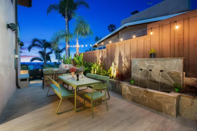 a view of a house with a yard porch and sitting area