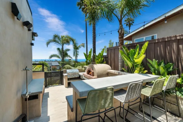a view of a patio with swimming pool table and chairs