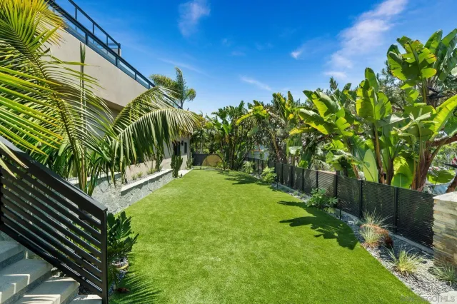 a bed room with a balcony and large window