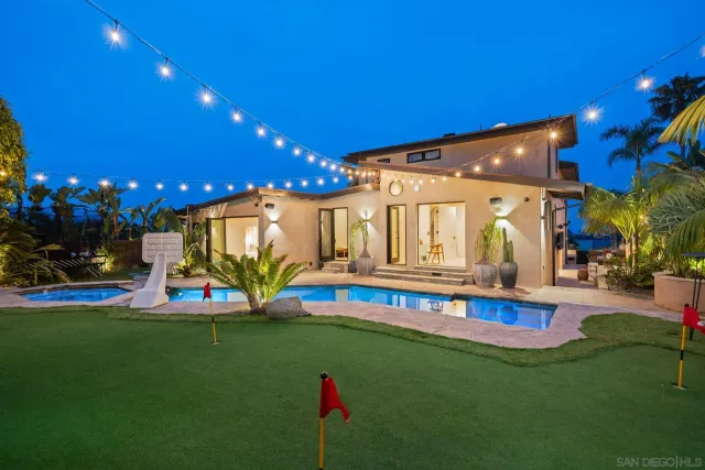 a living room with couch and a large window