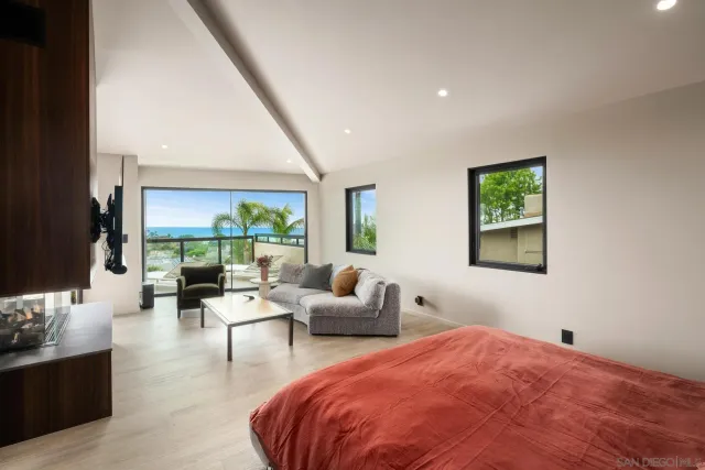a bathroom with a granite countertop sink and a window