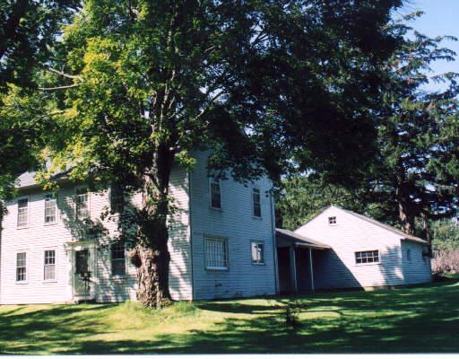 317 Goshen Route Litchfield, CT 06759 - Photo 1 of 1 a front view of a house with a garden and trees