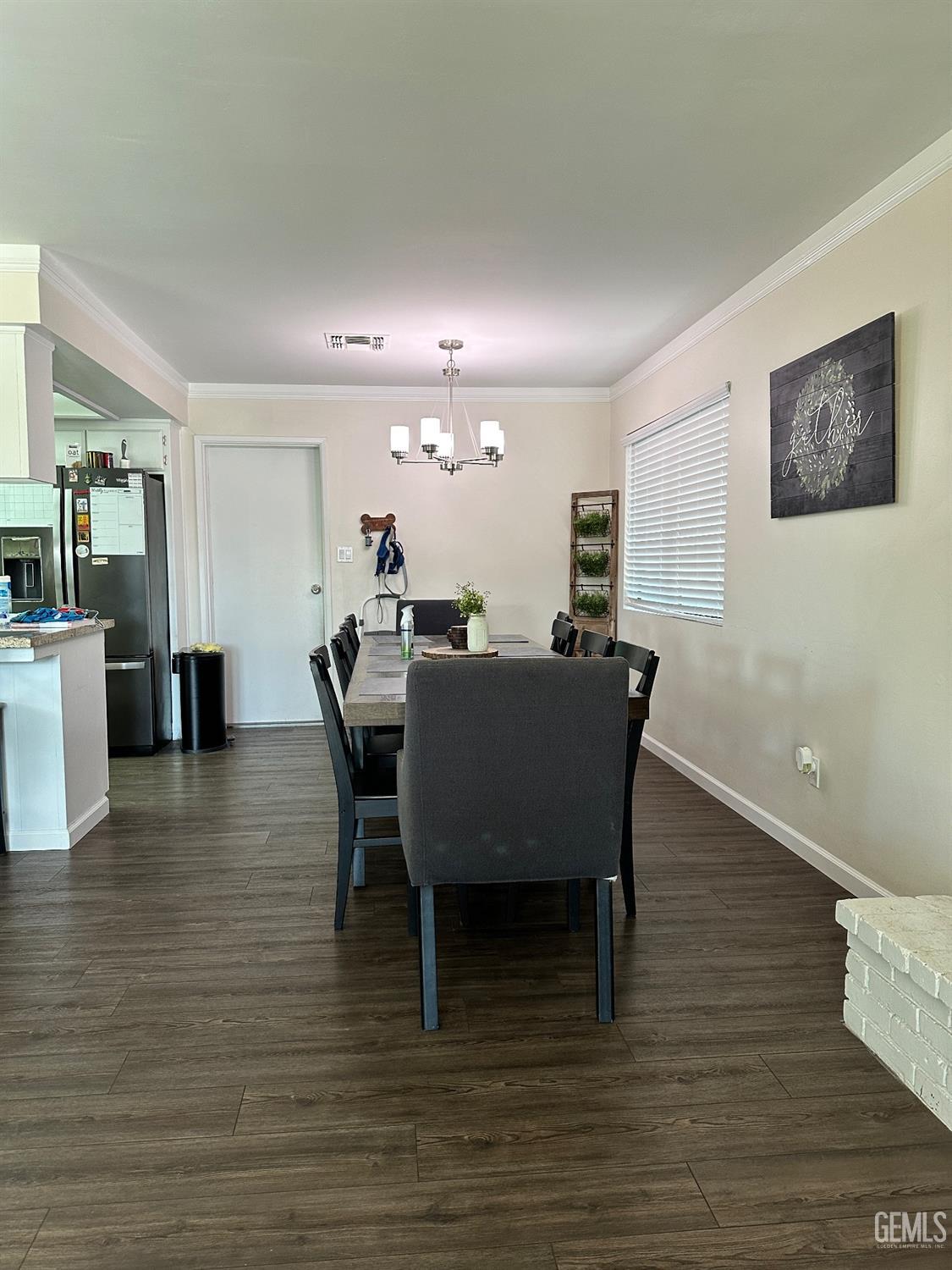 Undisclosed Address Bakersfield, CA 93312 - Photo 15 of 51 a view of a dining room with furniture and wooden floor