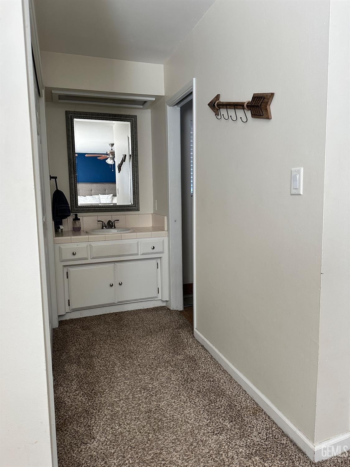 Undisclosed Address Bakersfield, CA 93312 - Photo 20 of 51 a view of bathroom with a sink mirror and window