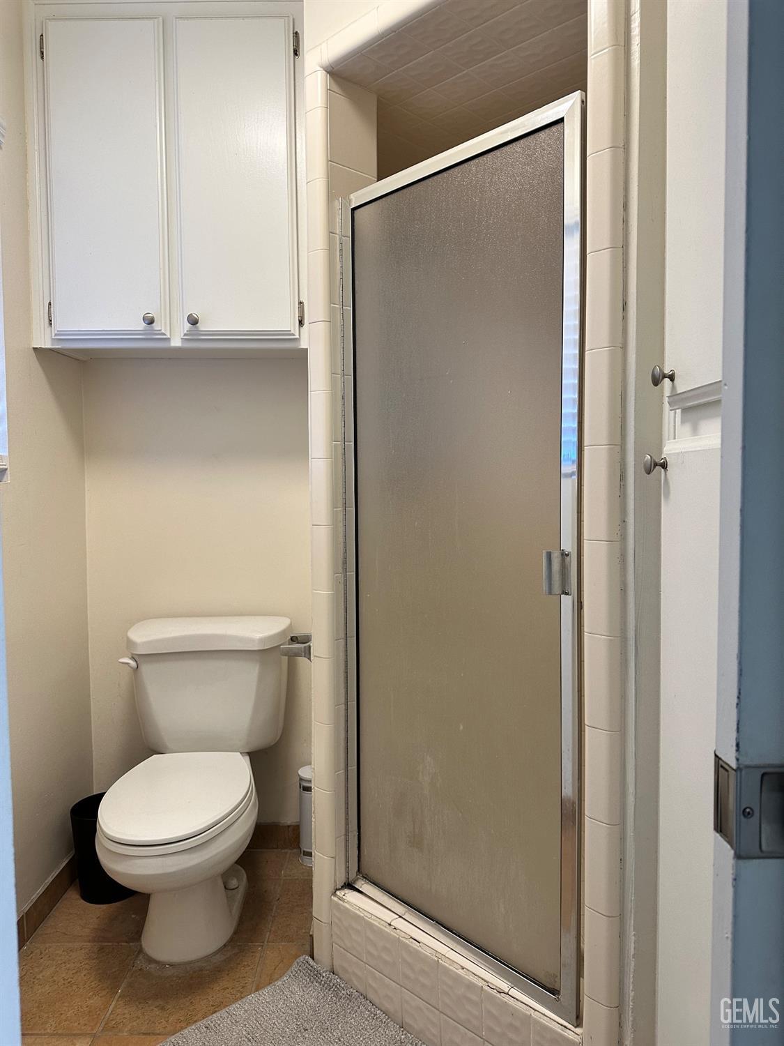 Undisclosed Address Bakersfield, CA 93312 - Photo 24 of 51 a bathroom with a toilet and a shower