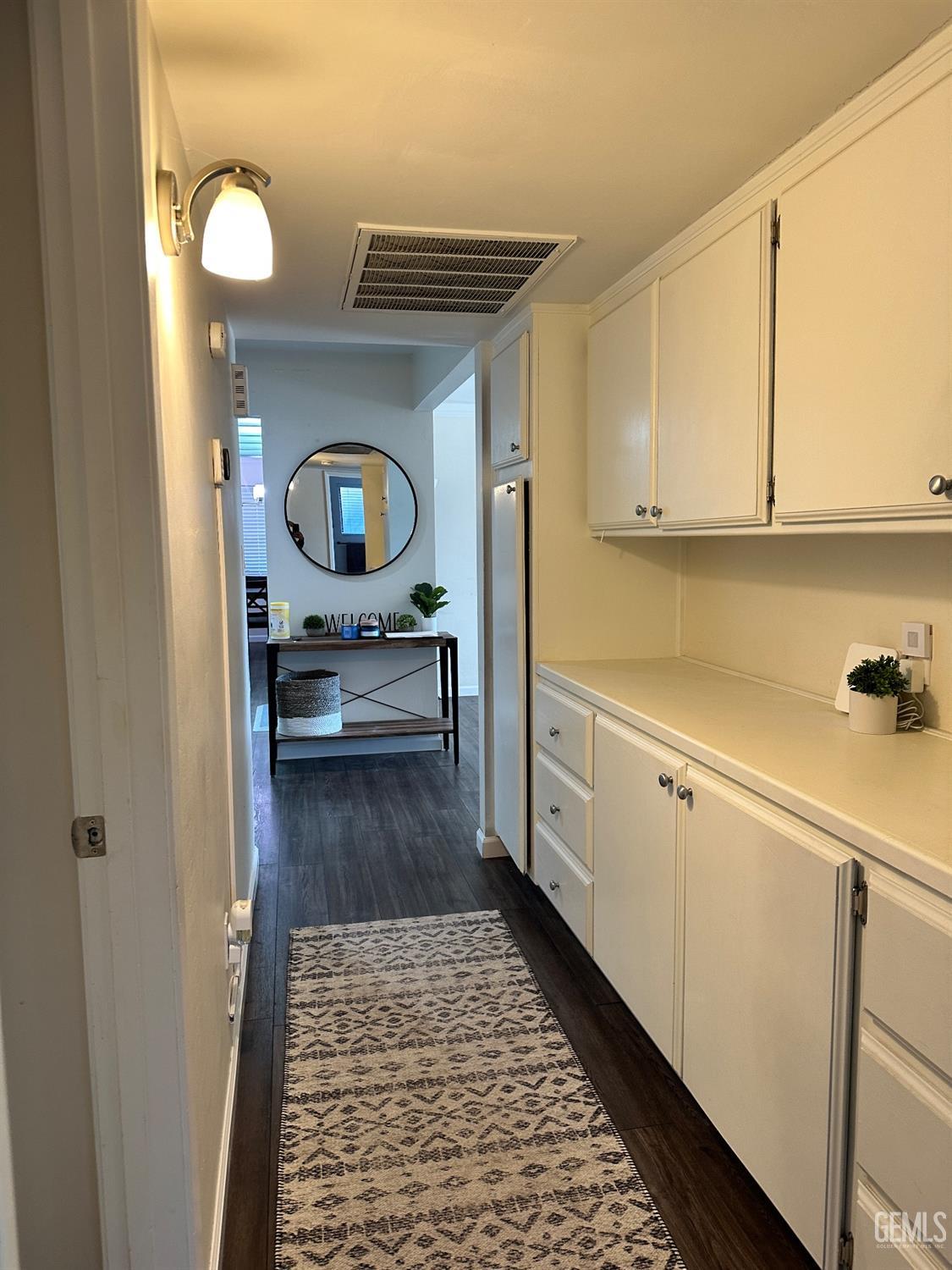 Undisclosed Address Bakersfield, CA 93312 - Photo 29 of 51 a kitchen with a refrigerator and a sink