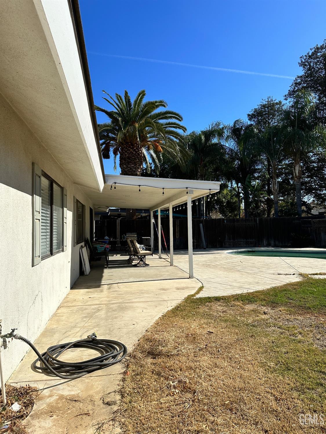 Undisclosed Address Bakersfield, CA 93312 - Photo 39 of 51 a view of a house with swimming pool and sitting area