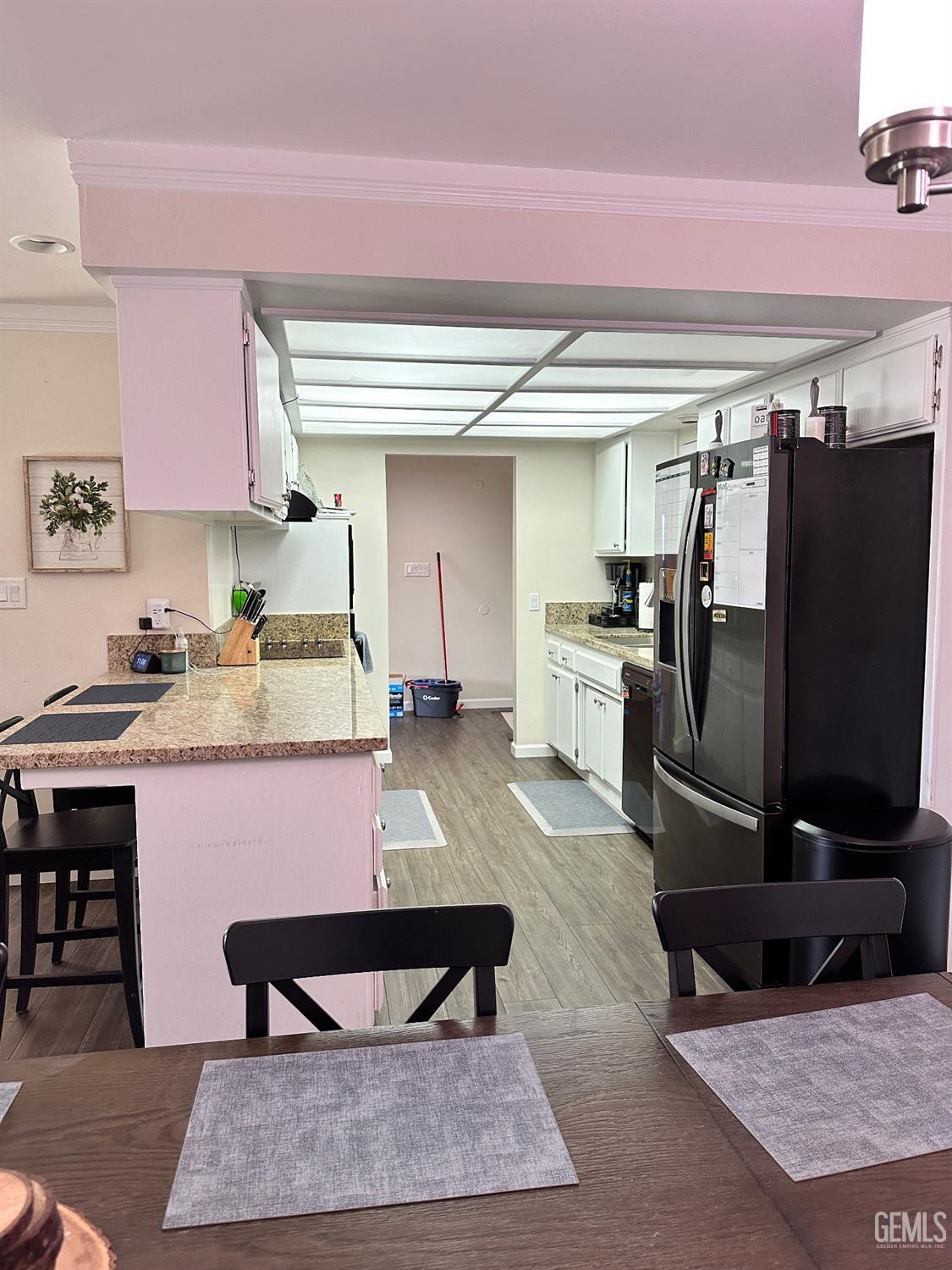 Undisclosed Address Bakersfield, CA 93312 - Photo 6 of 51 a kitchen with stainless steel appliances granite countertop a refrigerator table and chairs