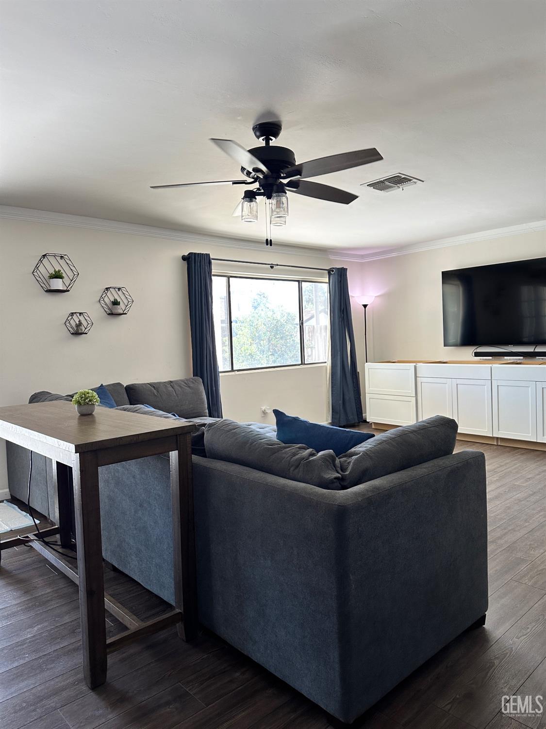 Undisclosed Address Bakersfield, CA 93312 - Photo 9 of 51 a living room with furniture and a flat screen tv