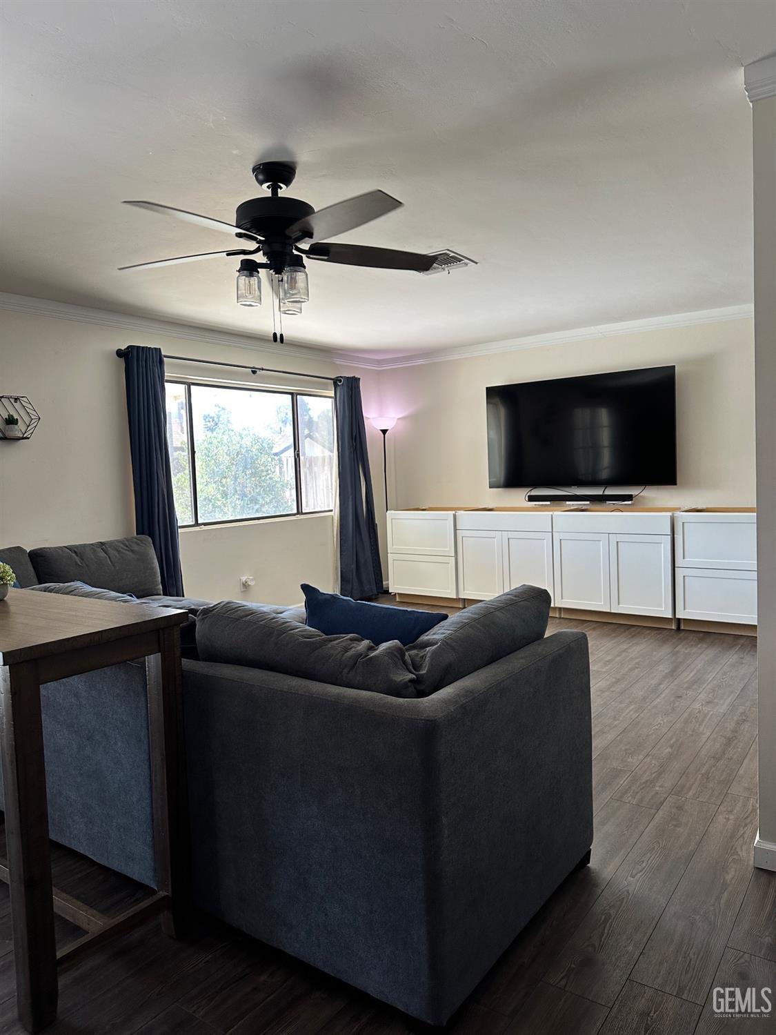 Undisclosed Address Bakersfield, CA 93312 - Photo 10 of 51 a living room with furniture and a flat screen tv