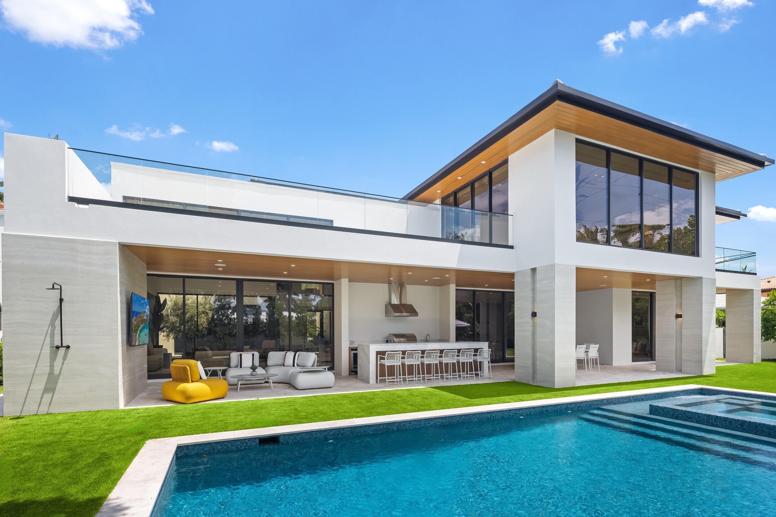 1351 Cocoanut Road Boca Raton, FL 33432 - Photo 52 of 101 a view of an house with swimming pool and porch with furniture