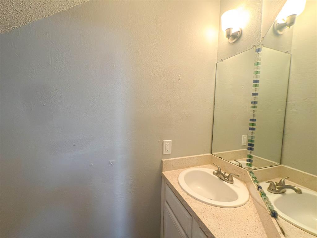 9696 Walnut Street, Unit 2108 Dallas, TX 75243 - Photo 11 of 21 a bathroom with a sink and a mirror