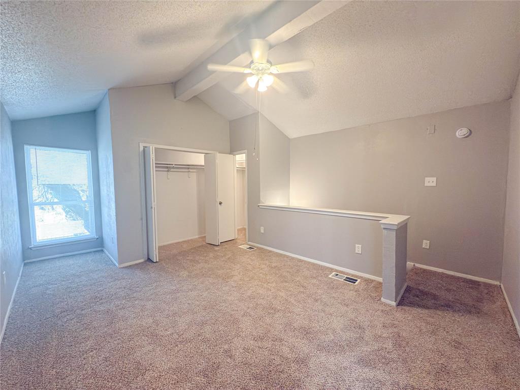 9696 Walnut Street, Unit 2108 Dallas, TX 75243 - Photo 14 of 21 an empty room with closet and a chandelier fan