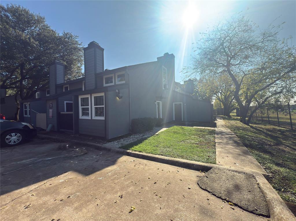 9696 Walnut Street, Unit 2108 Dallas, TX 75243 - Photo 2 of 21 a view of a house with a yard