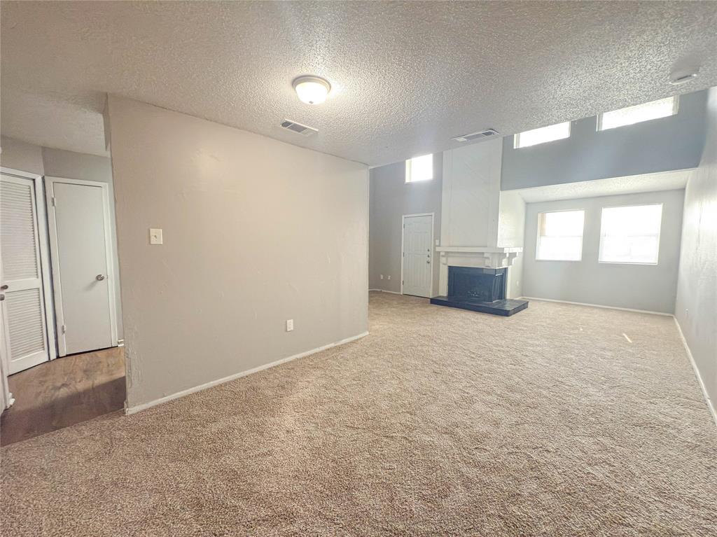 9696 Walnut Street, Unit 2108 Dallas, TX 75243 - Photo 3 of 21 an empty room with windows and entrance