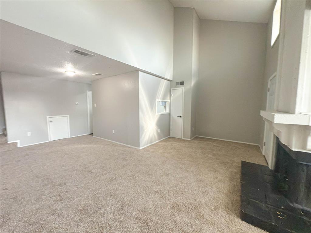 9696 Walnut Street, Unit 2108 Dallas, TX 75243 - Photo 5 of 21 a view of an empty room with a fireplace