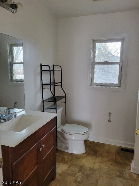 403 Highway 202, Unit B Raritan, NJ 08869 - Photo 5 of 9 a bathroom with a sink toilet and window
