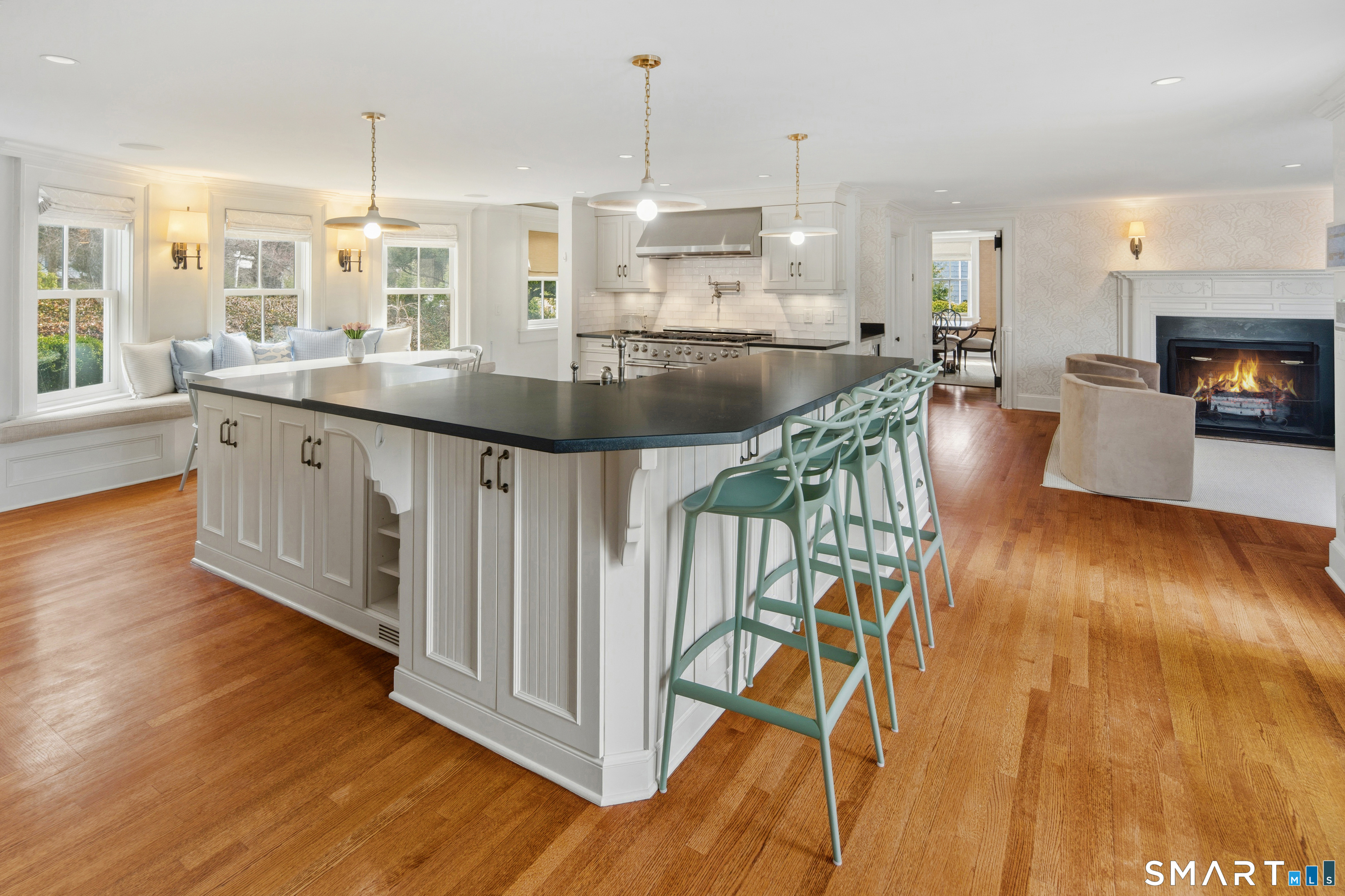 5 Middlesex Road Darien, CT 06820 - Photo 14 of 33 Kitchen open to family room with fireplace