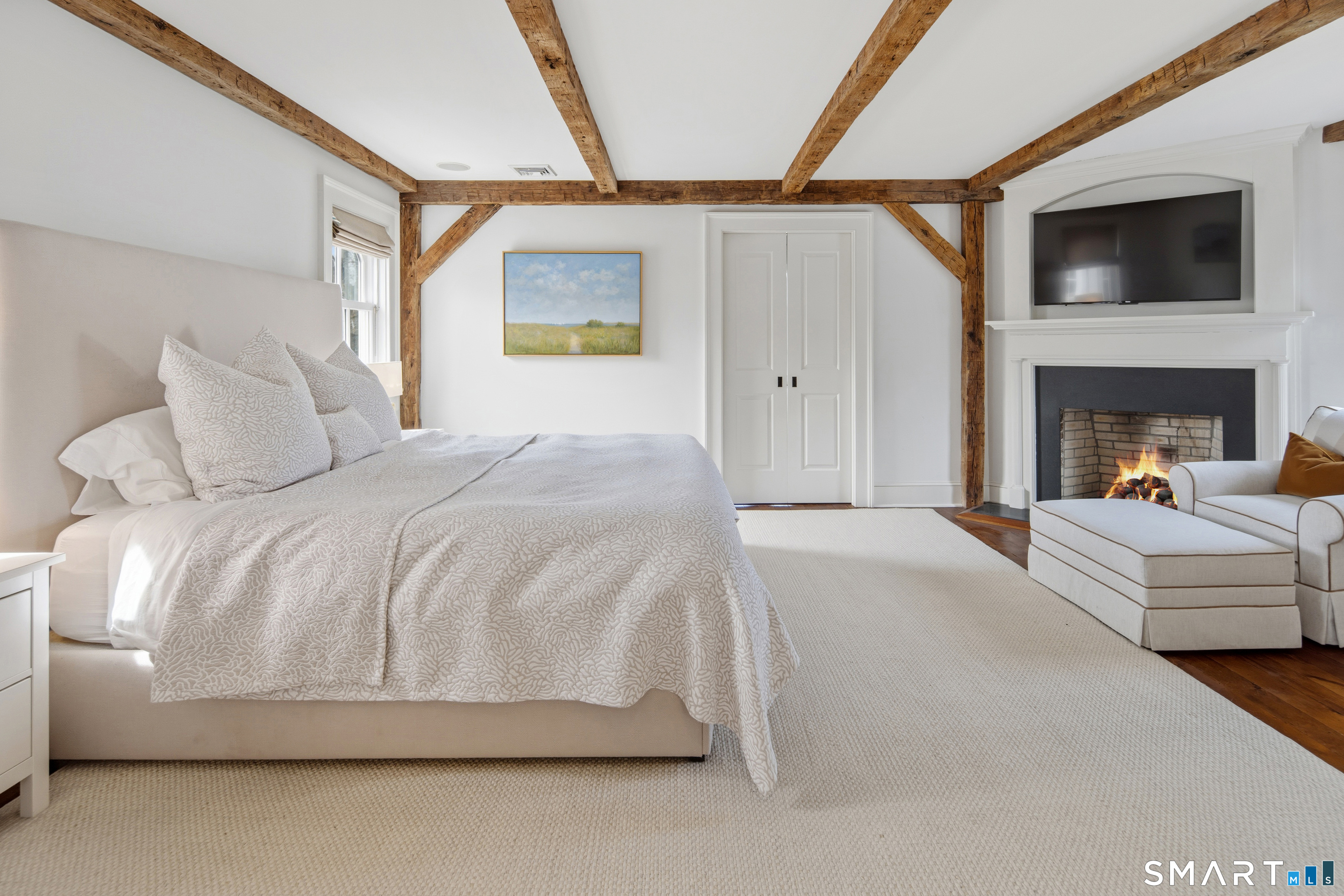 5 Middlesex Road Darien, CT 06820 - Photo 21 of 33 Gas fireplace and natural wood beams