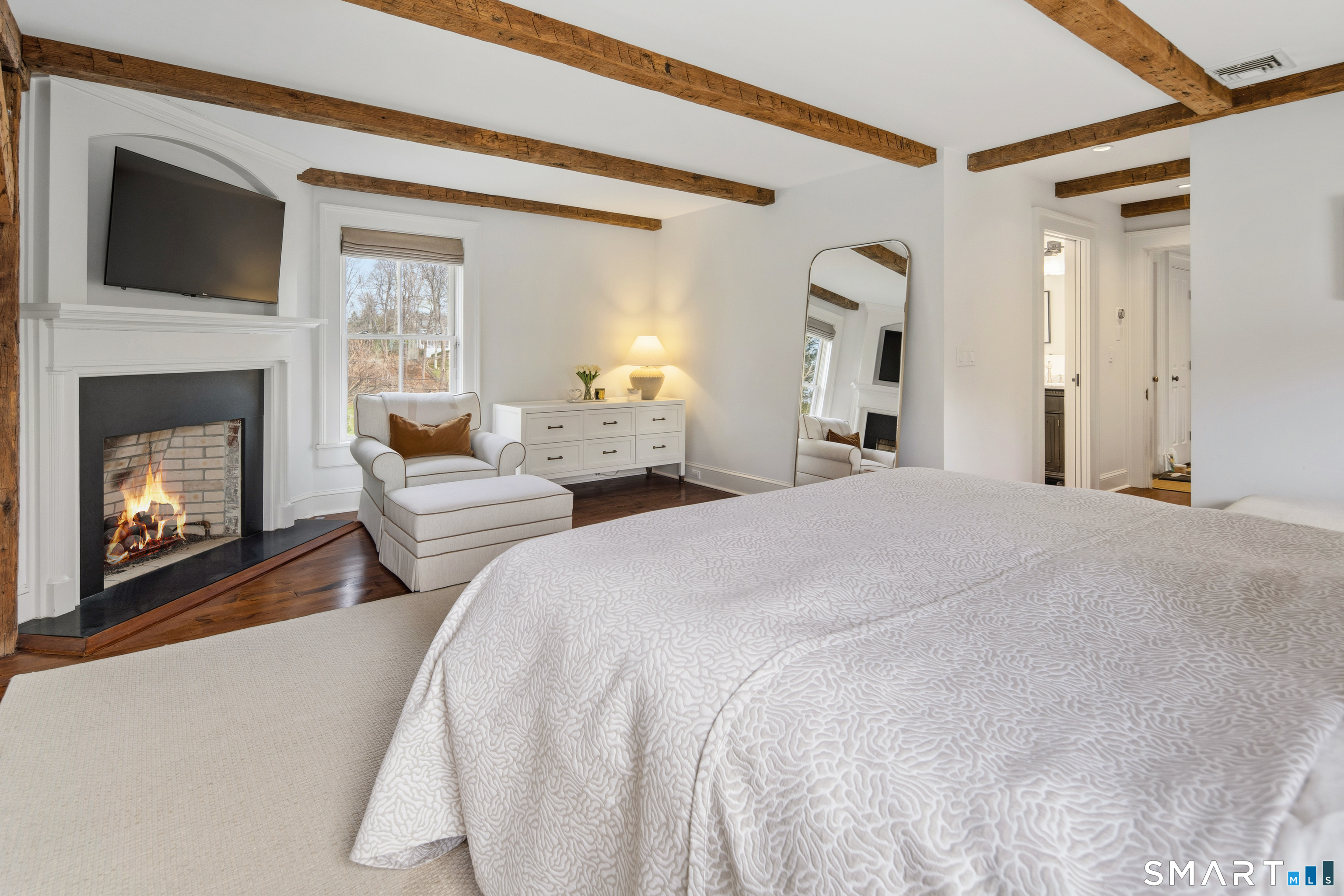 5 Middlesex Road Darien, CT 06820 - Photo 22 of 33 Gas fireplace and natural wood beams