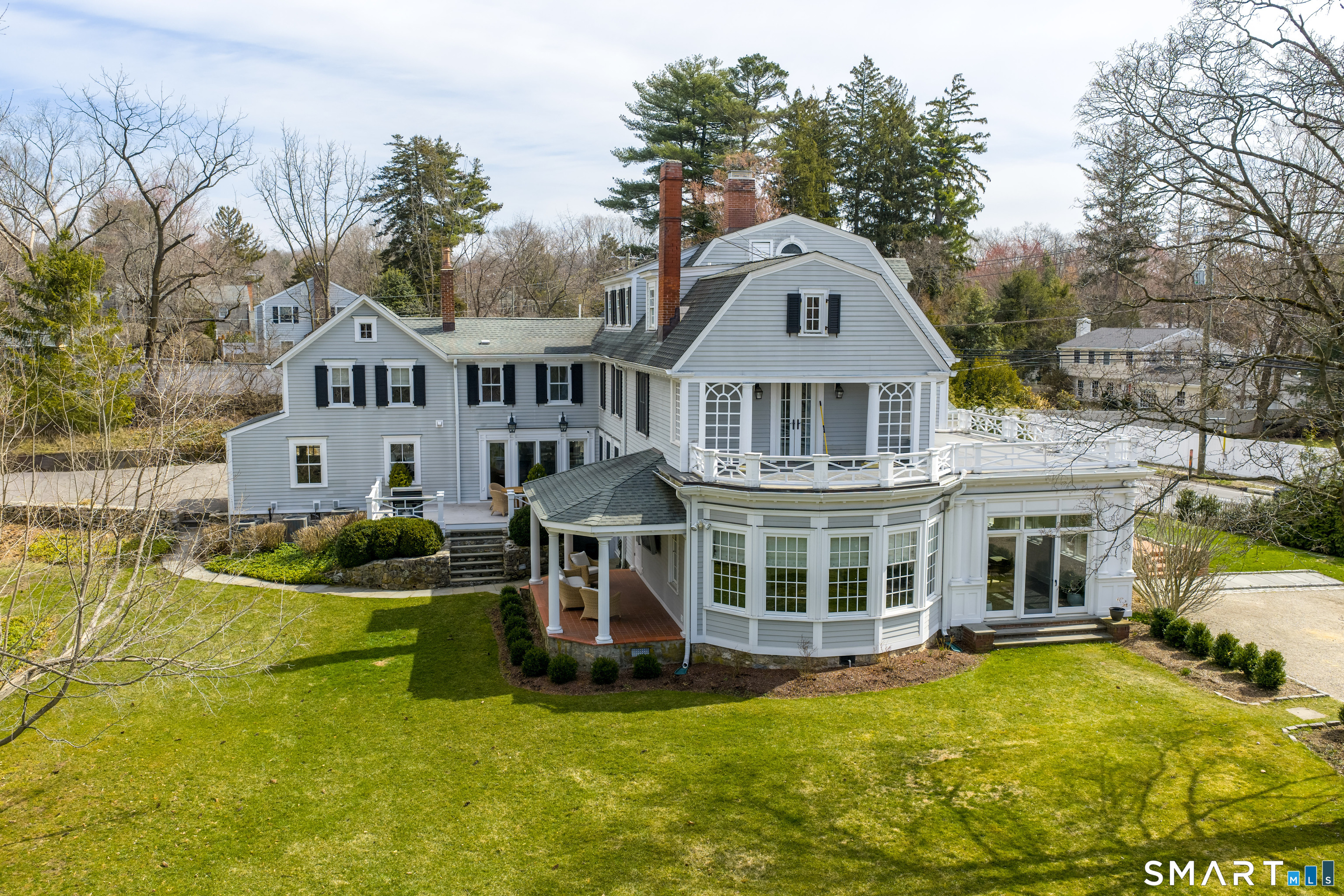 5 Middlesex Road Darien, CT 06820 - Photo 3 of 47 a front view of a house with a garden and yard