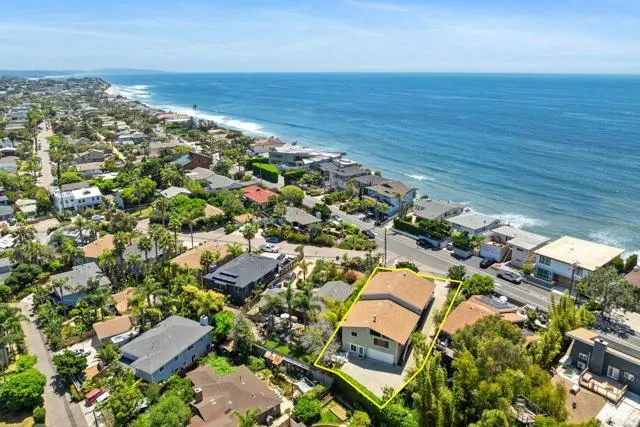 an aerial view of residential building and ocean