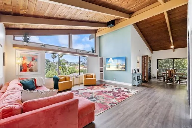 601 Neptune Avenue Encinitas, CA 92024 - Photo 14 of 36 a living room with furniture a couch and large window with outer view