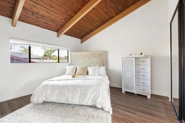 601 Neptune Avenue Encinitas, CA 92024 - Photo 21 of 36 a bedroom with a bed and a dresser