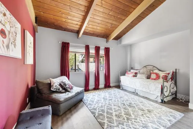 601 Neptune Avenue Encinitas, CA 92024 - Photo 23 of 36 a bedroom with furniture and a window