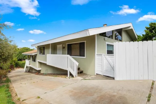601 Neptune Avenue Encinitas, CA 92024 - Photo 25 of 36 a view of a house with wooden fence