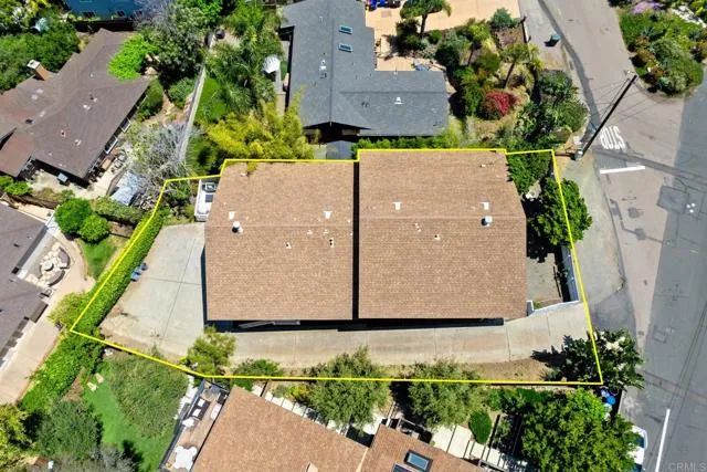 an aerial view of residential building with ocean view