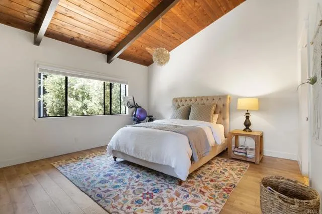 601 Neptune Avenue Encinitas, CA 92024 - Photo 8 of 36 a bedroom with a bed and a window