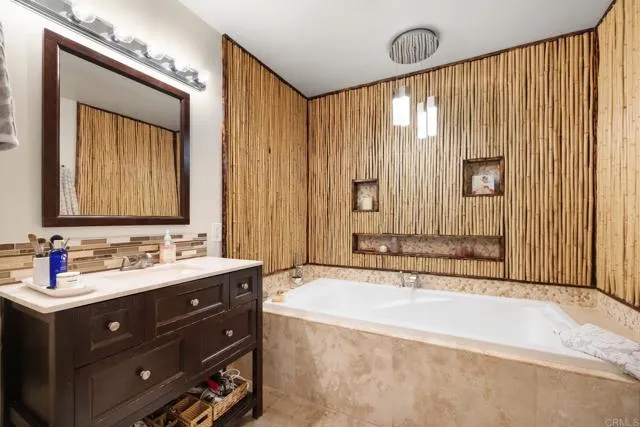 601 Neptune Avenue Encinitas, CA 92024 - Photo 9 of 36 a bathroom with a tub sink and mirror