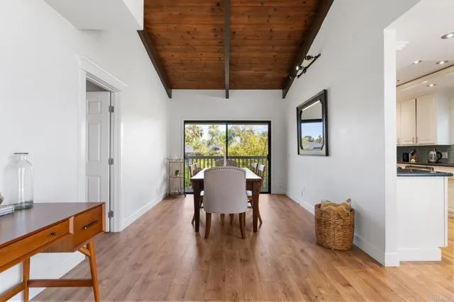 601 Neptune Avenue Encinitas, CA 92024 - Photo 10 of 36 a workspace with furniture window and wooden floor