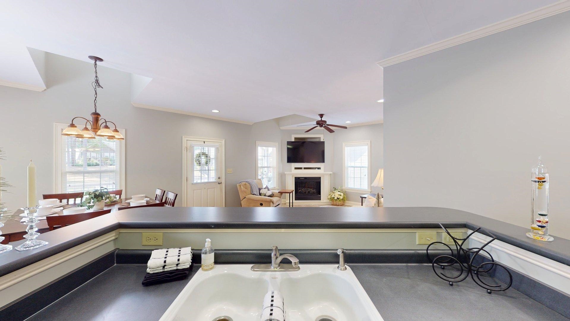 12 Jennifer Junction Iuka, MS 38852 - Photo 11 of 40 a kitchen with a sink dishwasher and a fireplace with wooden floor