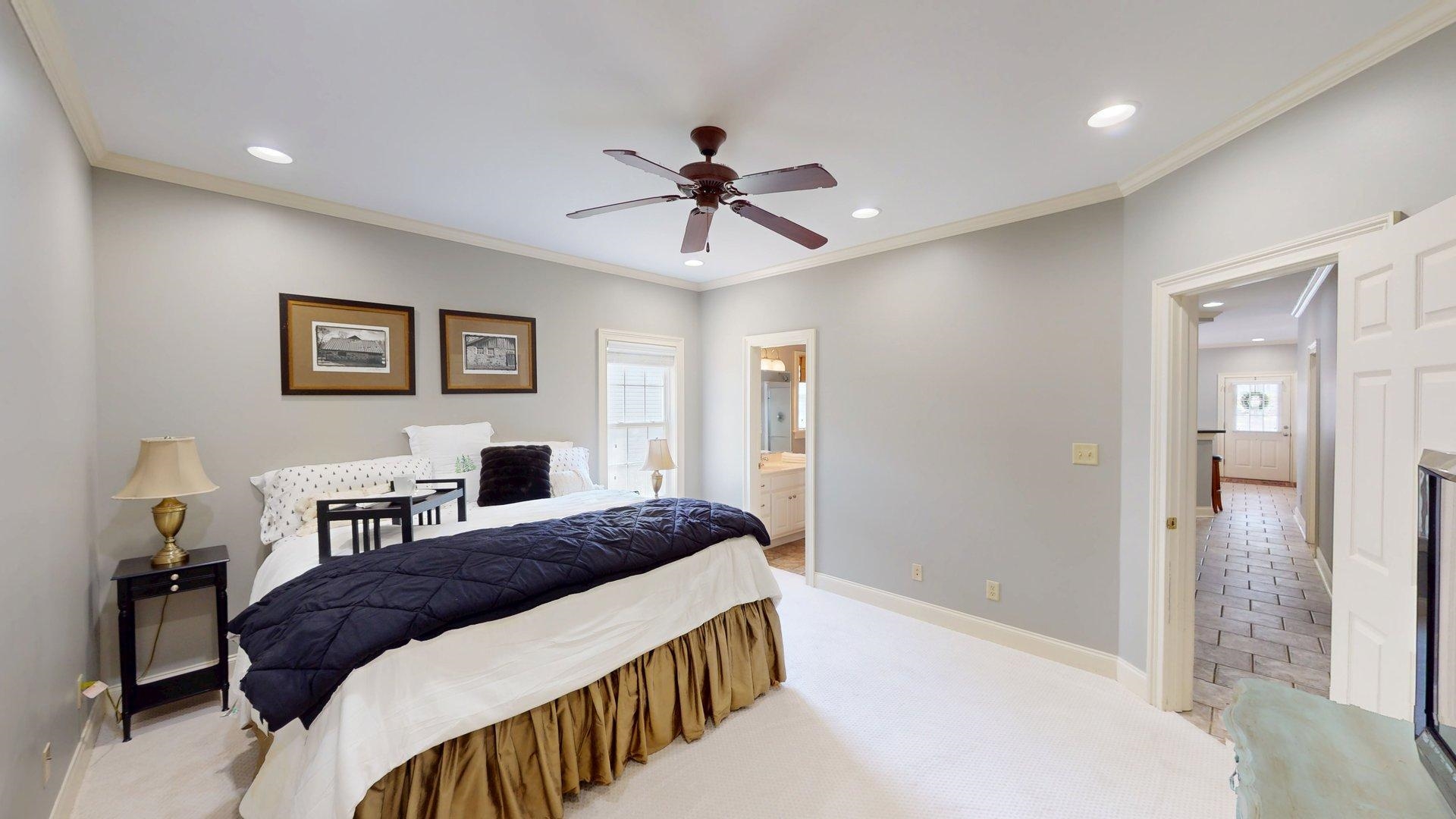 12 Jennifer Junction Iuka, MS 38852 - Photo 17 of 40 a bedroom with a bed and a chandelier