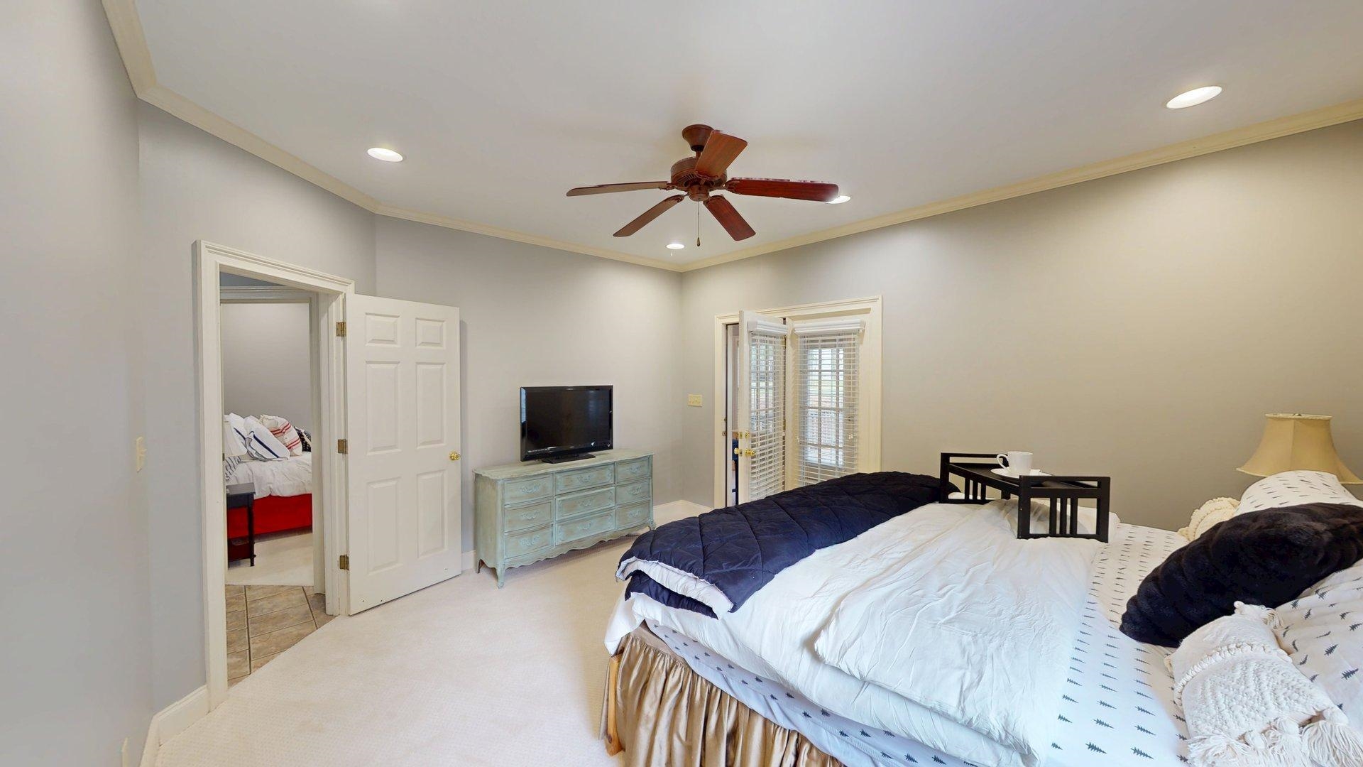 12 Jennifer Junction Iuka, MS 38852 - Photo 18 of 40 a bedroom with a bed and a flat screen tv