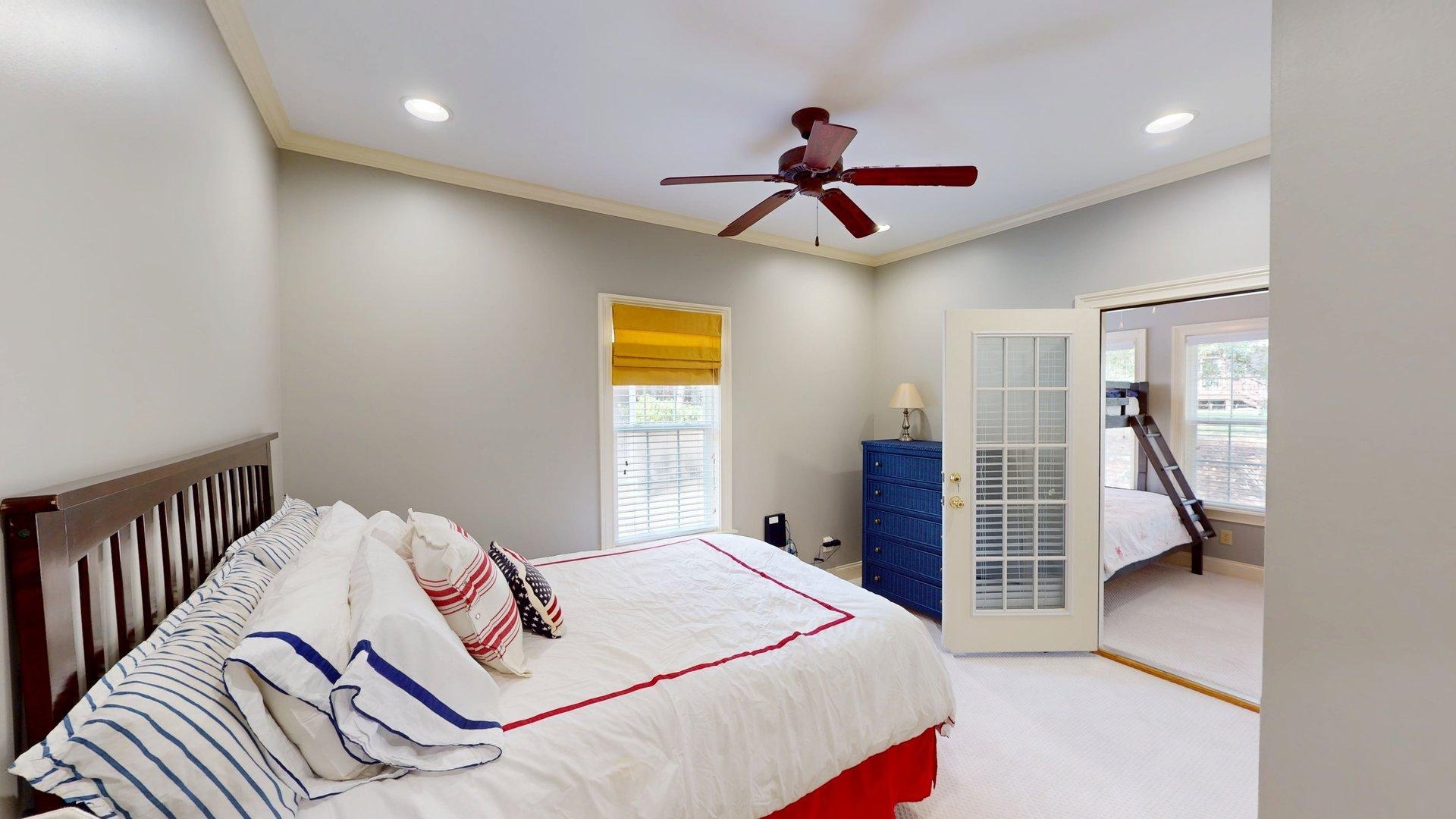 12 Jennifer Junction Iuka, MS 38852 - Photo 21 of 40 a bedroom with a large bed and a chandelier