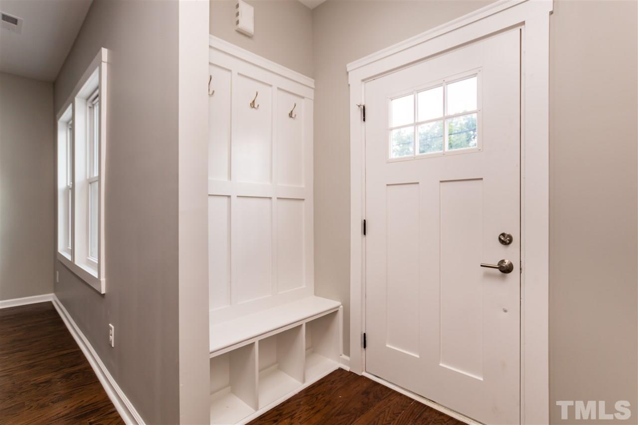 830 East Martin Street Raleigh, NC 27601 - Photo 3 of 24 a view of a hallway with wooden floor and closet