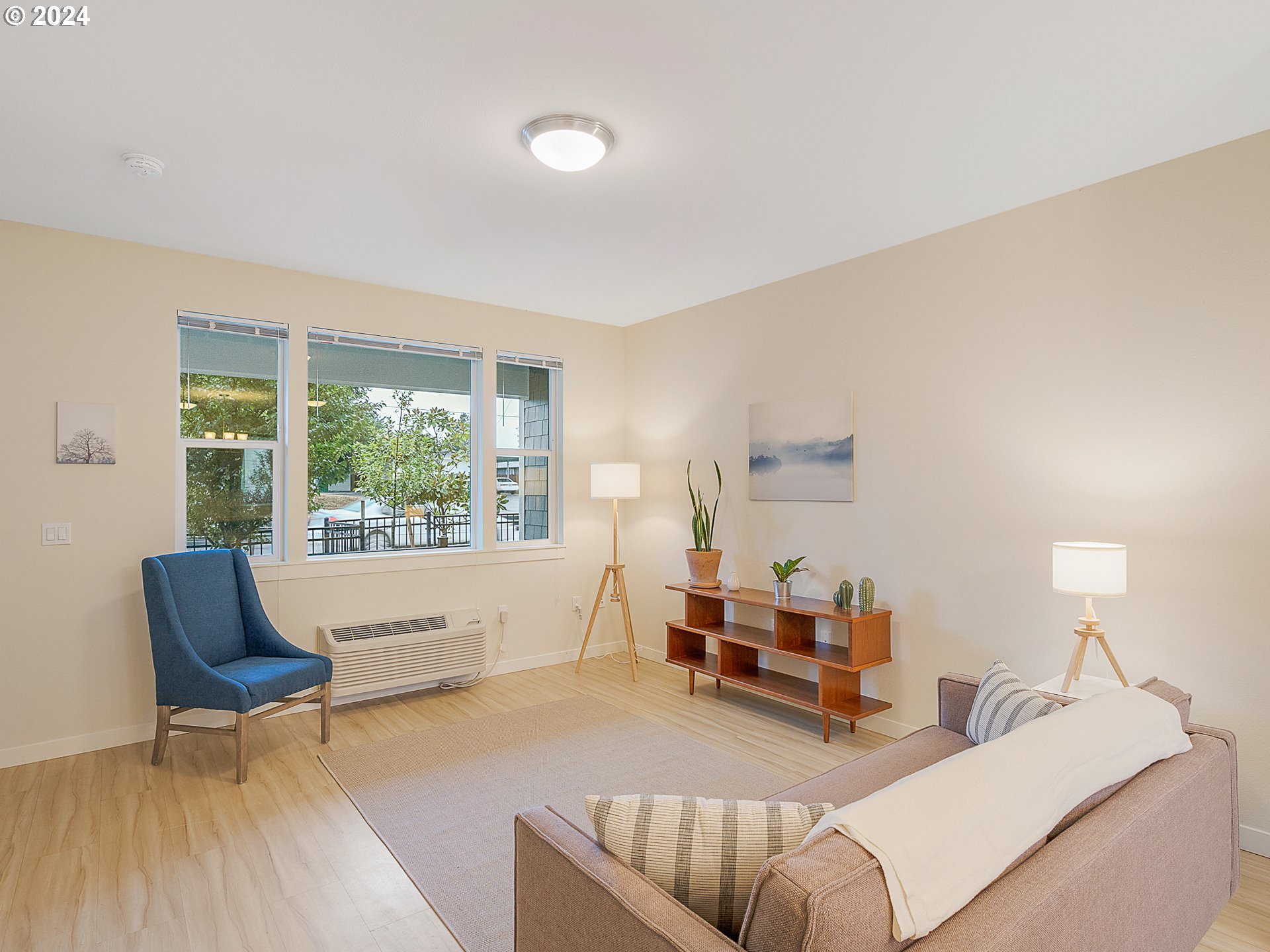 10827 East Burnside Street Portland, OR 97216 - Photo 12 of 28 a living room with furniture and a window