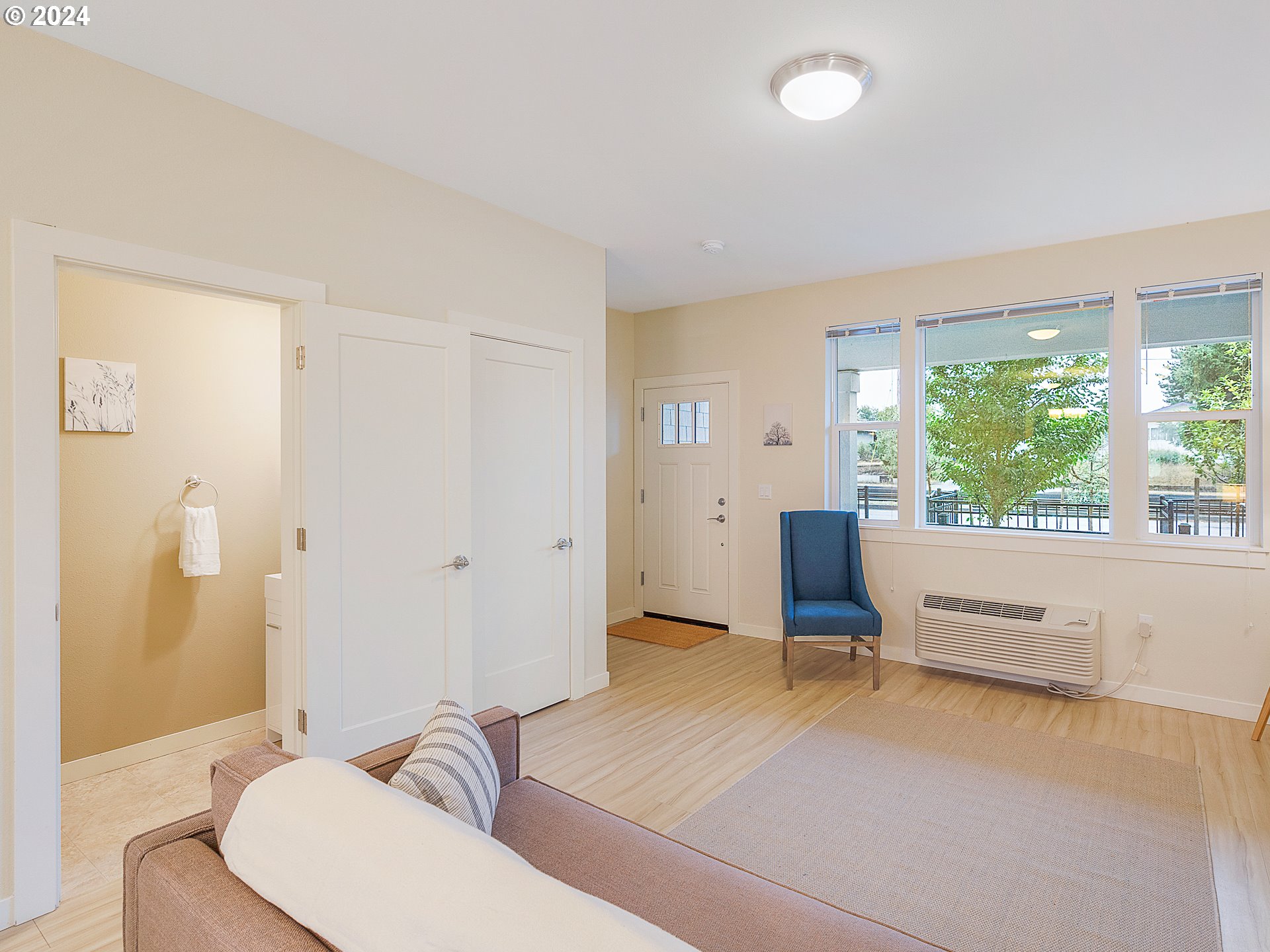 10827 East Burnside Street Portland, OR 97216 - Photo 13 of 28 a living room with furniture and large windows