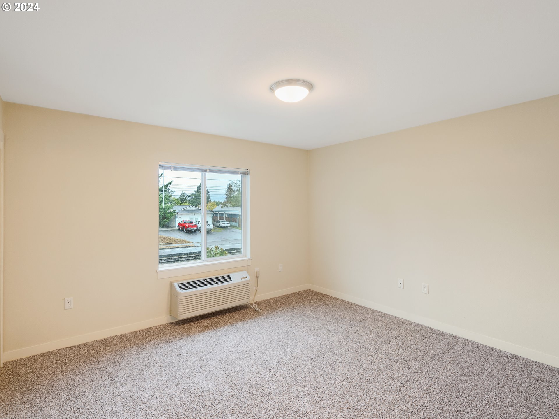 10827 East Burnside Street Portland, OR 97216 - Photo 14 of 28 an empty room with windows