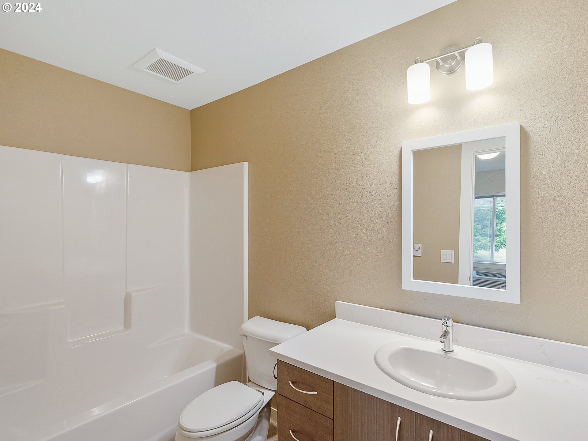 10827 East Burnside Street Portland, OR 97216 - Photo 17 of 28 a bathroom with a sink toilet and shower