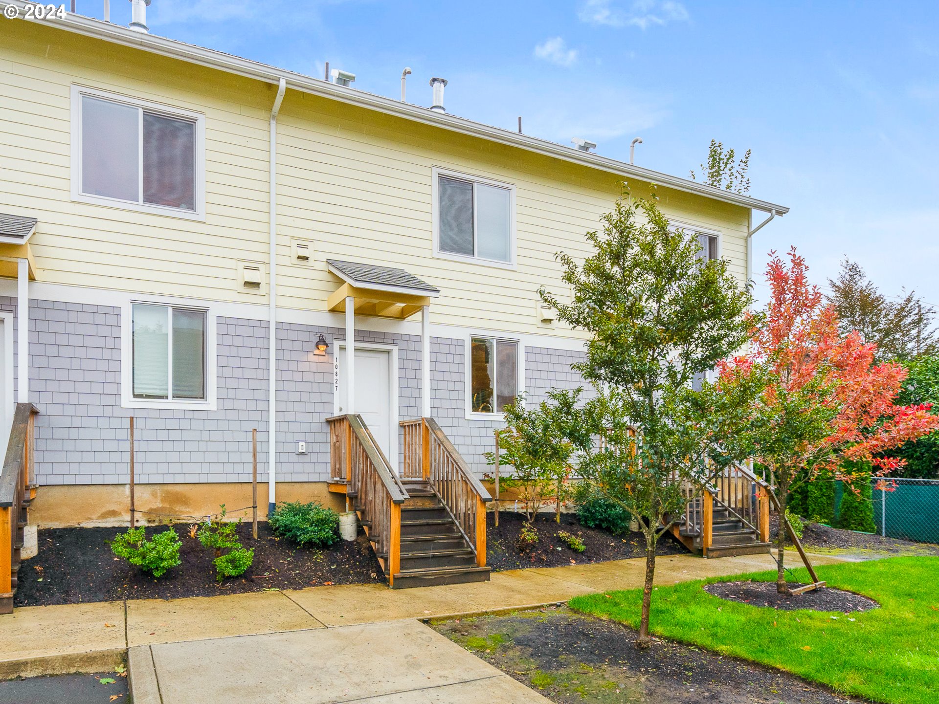 10827 East Burnside Street Portland, OR 97216 - Photo 25 of 28 a front view of a house with garden